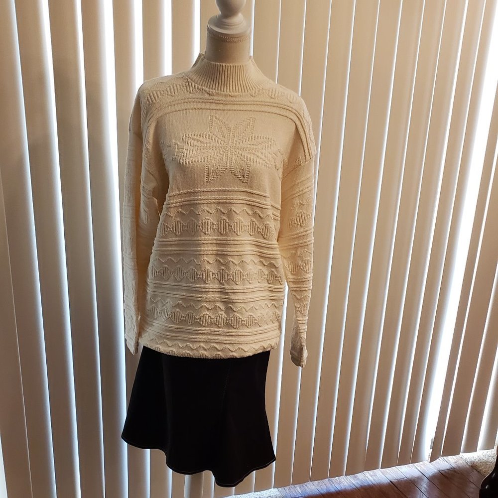 A Knitch Above